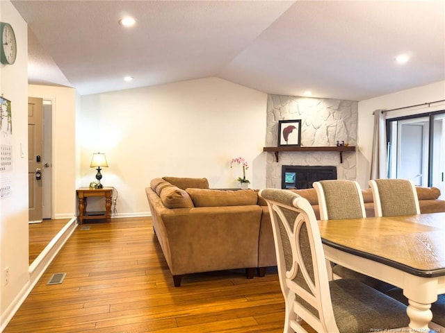 6739 Irongate Dr Unit B, Fayetteville, NC 28306 - living area featuring visible vents, baseboards, lofted ceiling, and hardwood / wood-style floors