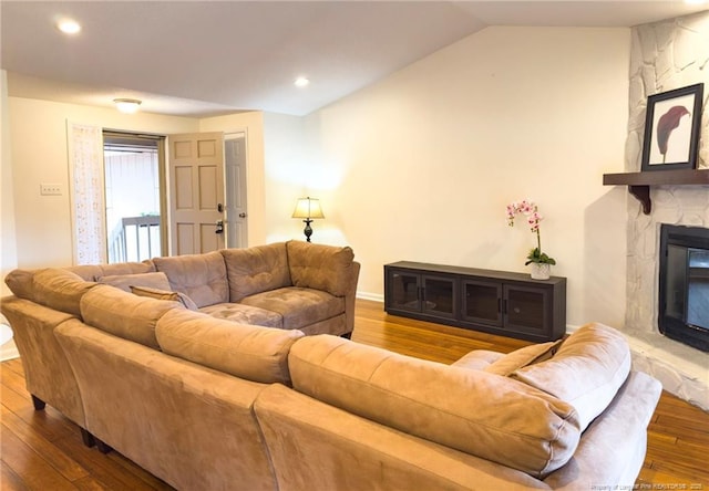 6739 Irongate Dr Unit B, Fayetteville, NC 28306 - living area featuring recessed lighting, lofted ceiling, wood finished floors, and a fireplace