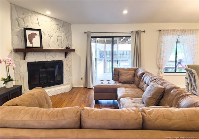 6739 Irongate Dr Unit B, Fayetteville, NC 28306 - living room with recessed lighting, baseboards, a stone fireplace, and wood finished floors