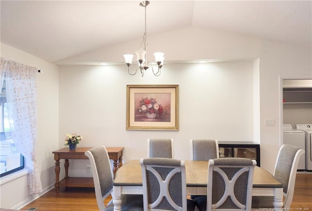 6739 Irongate Dr Unit B, Fayetteville, NC 28306 - dining space featuring washer and dryer, an inviting chandelier, wood finished floors, and lofted ceiling