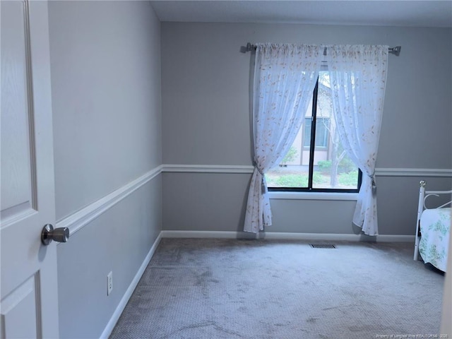 6739 Irongate Dr Unit B, Fayetteville, NC 28306 - unfurnished bedroom with visible vents, carpet flooring, and baseboards