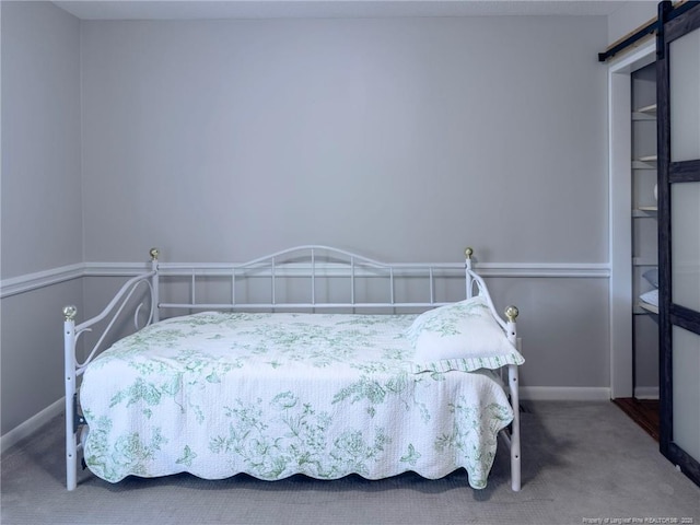 6739 Irongate Dr Unit B, Fayetteville, NC 28306 - carpeted bedroom featuring baseboards and a barn door