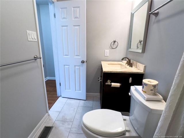 6739 Irongate Dr Unit B, Fayetteville, NC 28306 - bathroom featuring vanity, baseboards, tile patterned floors, and toilet