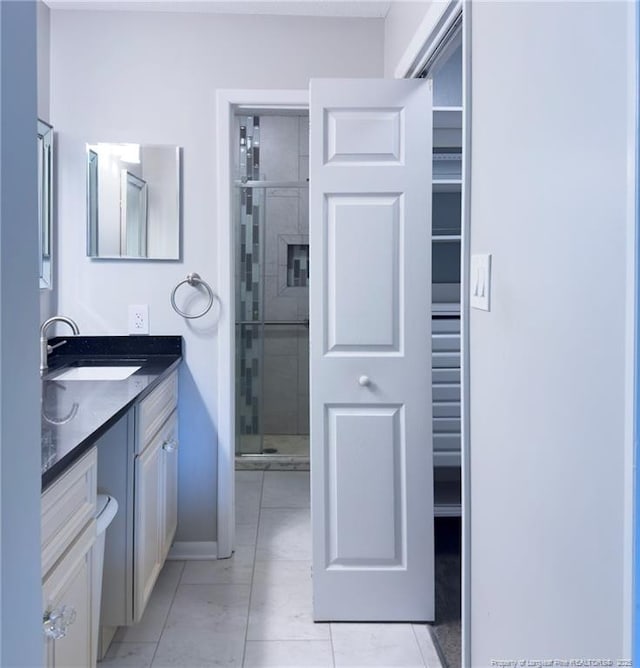 6739 Irongate Dr Unit B, Fayetteville, NC 28306 - full bathroom with vanity, baseboards, and a shower stall
