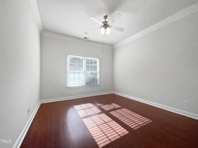 2651 Lockwood Rd Unit 201, Fayetteville, NC 28303 - empty room featuring crown molding, visible vents, baseboards, dark wood-type flooring, and a ceiling fan