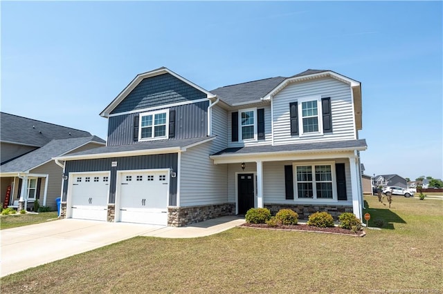 craftsman house featuring an attached garage, driveway, a front lawn, and stone siding