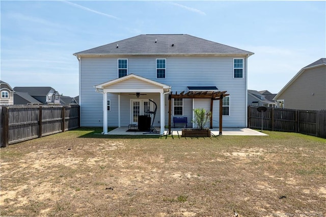 rear view of house featuring a fenced backyard, a ceiling fan, a pergola, and a patio area