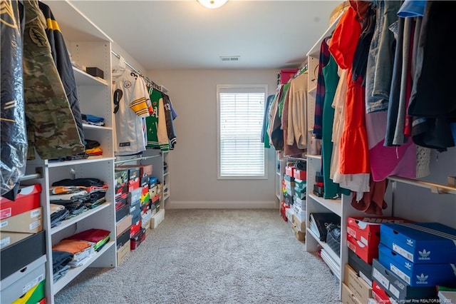 walk in closet featuring carpet floors and visible vents