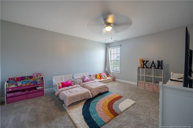 bedroom featuring baseboards, carpet, and a ceiling fan