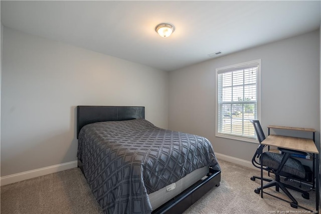bedroom with visible vents, carpet, and baseboards