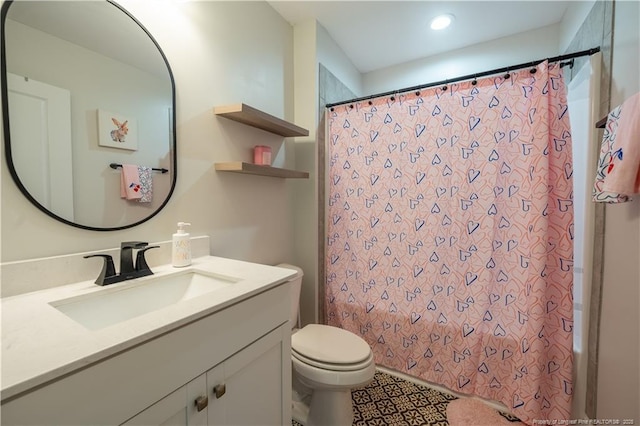 bathroom featuring recessed lighting, vanity, shower / bath combo, and toilet
