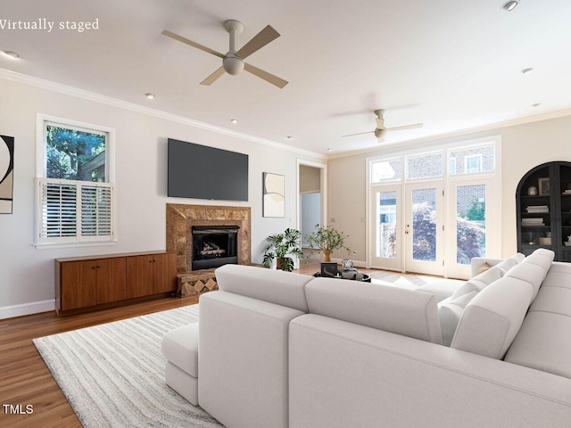 1605 Park Dr, Raleigh, NC 27605 - living room featuring ceiling fan, a fireplace, wood finished floors, baseboards, and ornamental molding