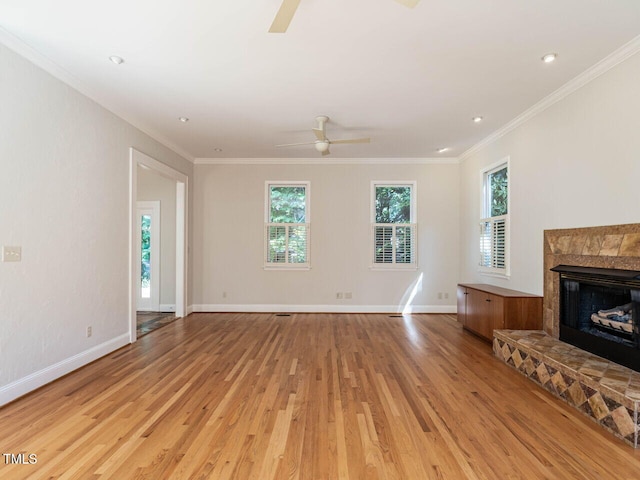1605 Park Dr, Raleigh, NC 27605 - unfurnished living room with light wood-type flooring, a ceiling fan, baseboards, and crown molding