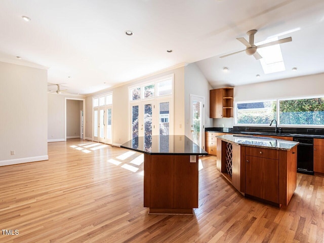 1605 Park Dr, Raleigh, NC 27605 - kitchen with open shelves, a ceiling fan, and a kitchen island