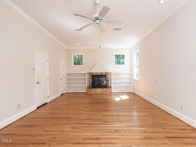 1605 Park Dr, Raleigh, NC 27605 - unfurnished living room with a high end fireplace, crown molding, and a wealth of natural light