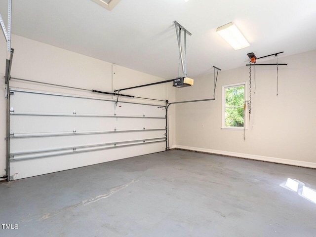1605 Park Dr, Raleigh, NC 27605 - garage with baseboards and a garage door opener