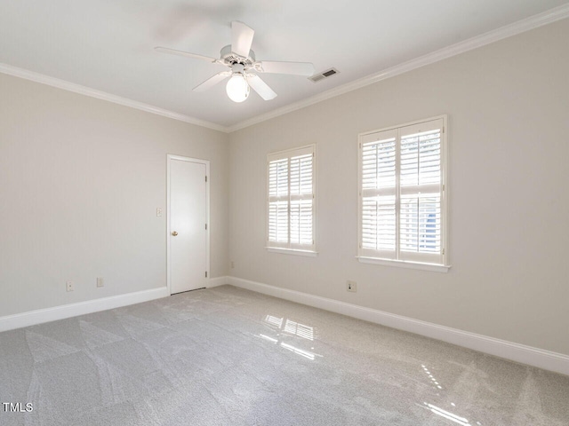 1605 Park Dr, Raleigh, NC 27605 - empty room featuring visible vents, ornamental molding, a ceiling fan, and light colored carpet