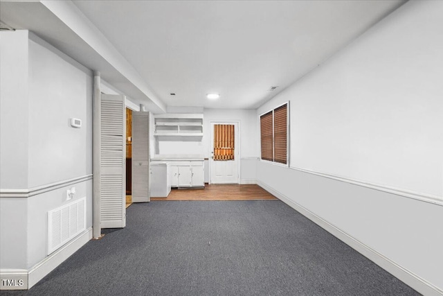 corridor with baseboards, carpet, recessed lighting, and visible vents