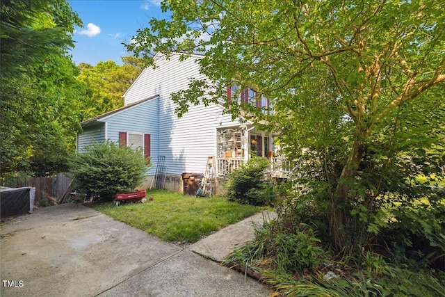 view of side of property with fence