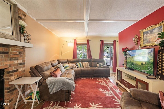 living room with a textured ceiling, wood finished floors, and a fireplace