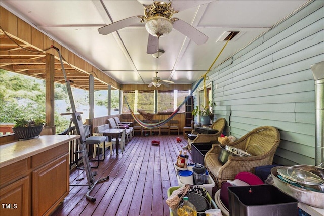 exterior space with ceiling fan