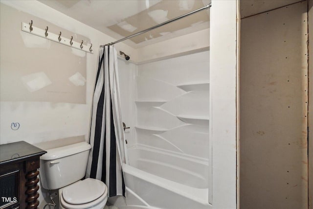 full bathroom with vanity, shower / bath combo with shower curtain, and toilet