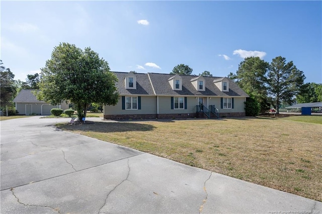390 Sandy Ridge Rd, Dunn, NC 28334 - cape cod-style house with driveway and a front lawn