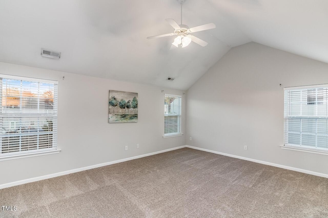 2902 Framer Ln, Durham, NC 27704 - spare room featuring vaulted ceiling, carpet, baseboards, and ceiling fan
