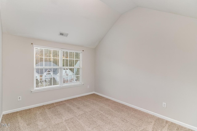 2902 Framer Ln, Durham, NC 27704 - carpeted empty room with lofted ceiling and baseboards
