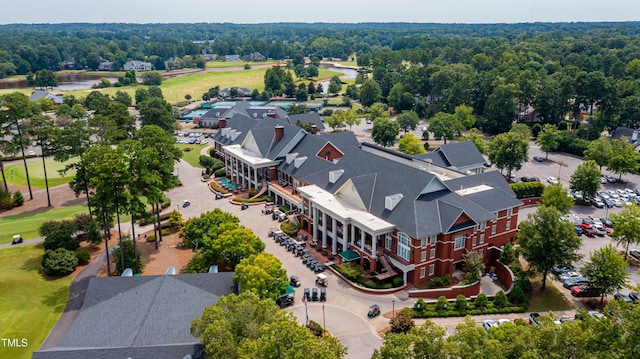 bird's eye view with a water view and view of golf course