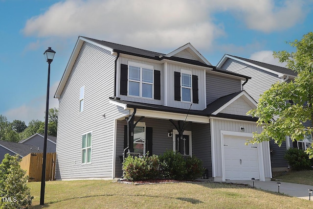 view of front of house with fence, an attached garage, a front lawn, board and batten siding, and a porch