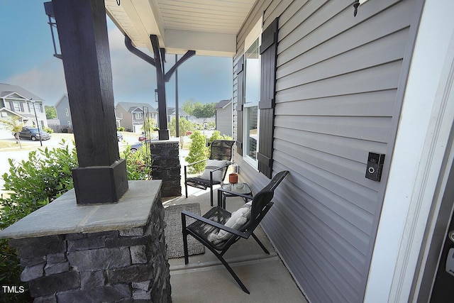 view of patio with a porch and a residential view