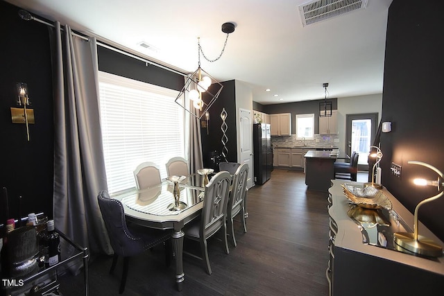 dining room with recessed lighting, visible vents, and dark wood-type flooring