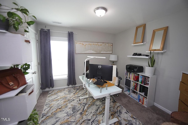 office area with baseboards, carpet flooring, and visible vents