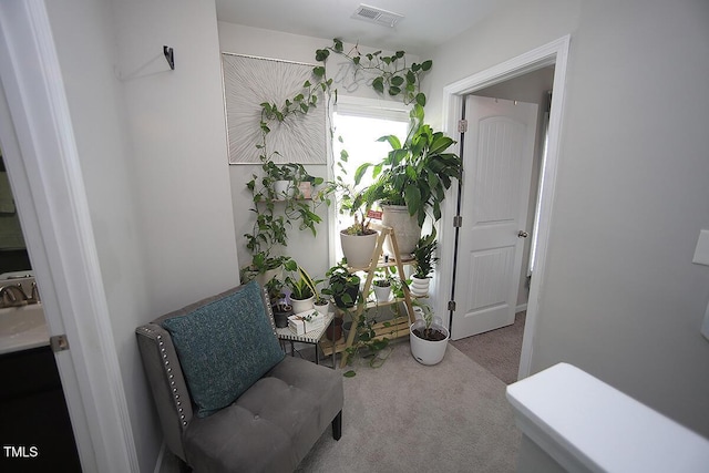 sitting room featuring carpet and visible vents