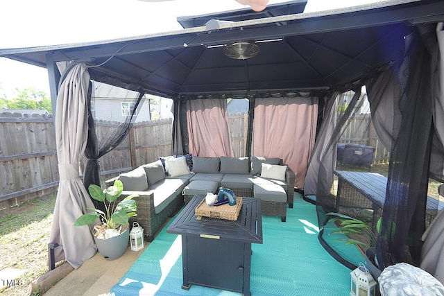 view of patio / terrace with a gazebo, an outdoor hangout area, and a fenced backyard