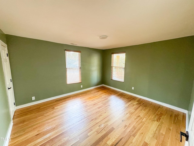 1100 Chester St, Durham, NC 27701 - spare room with baseboards and light wood-style flooring
