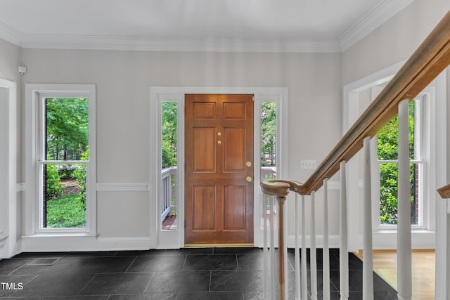 entrance foyer with crown molding, baseboards, a wealth of natural light, and stairway