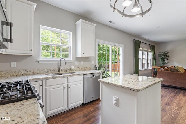 8408 Haines Creek Ln, Raleigh, NC 27616 - kitchen featuring dishwasher, a sink, open floor plan, white cabinetry, and dark wood-type flooring