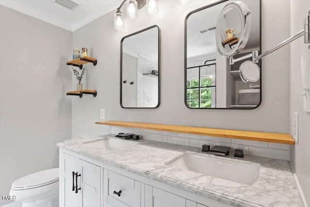 8408 Haines Creek Ln, Raleigh, NC 27616 - bathroom with visible vents, double vanity, a sink, and toilet