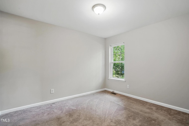 5414 Stanley Rd, Durham, NC 27704 - unfurnished room with baseboards, carpet floors, and visible vents