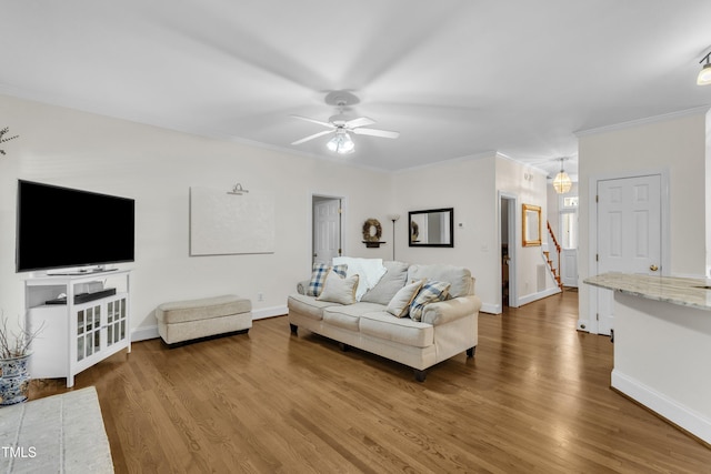 111 Ferncroft Ct, Cary, NC 27519 - living area featuring ornamental molding, wood finished floors, ceiling fan, and baseboards
