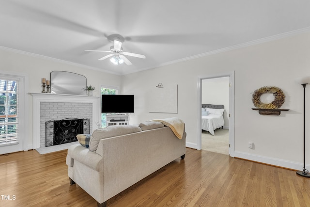 111 Ferncroft Ct, Cary, NC 27519 - living area with ornamental molding, a ceiling fan, healthy amount of natural light, and light wood finished floors