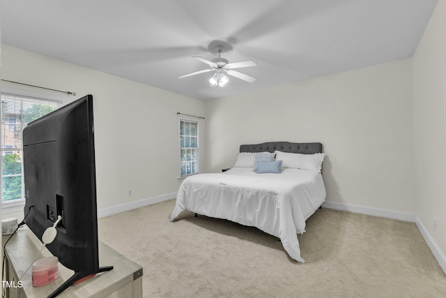111 Ferncroft Ct, Cary, NC 27519 - carpeted bedroom with multiple windows, baseboards, and ceiling fan