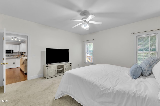 111 Ferncroft Ct, Cary, NC 27519 - bedroom featuring light carpet and ceiling fan