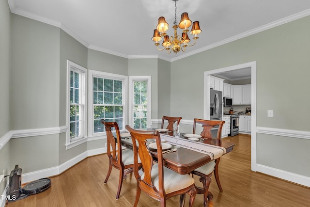 111 Ferncroft Ct, Cary, NC 27519 - dining room featuring a chandelier, light wood-style flooring, crown molding, and baseboards