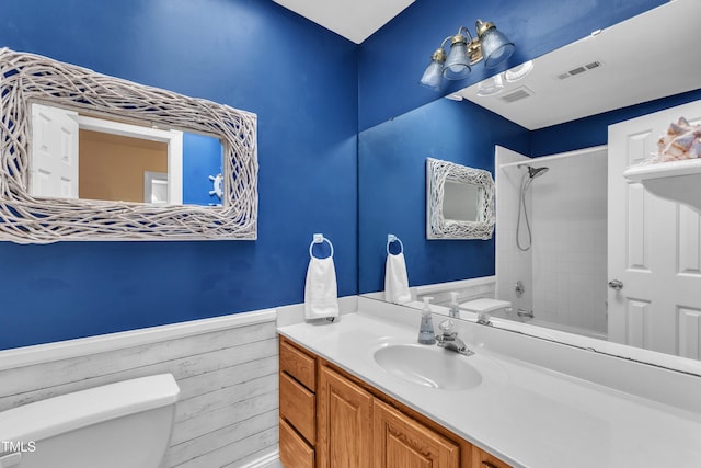 111 Ferncroft Ct, Cary, NC 27519 - full bath with toilet, vanity, a wainscoted wall, and shower / bathtub combination