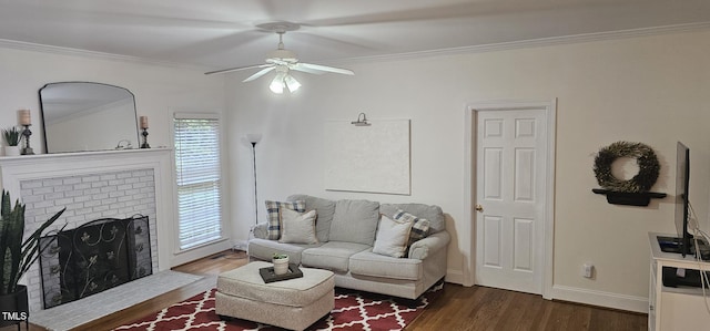 111 Ferncroft Ct, Cary, NC 27519 - living room featuring a ceiling fan, wood finished floors, crown molding, and a brick fireplace