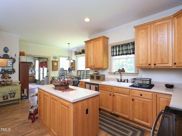 kitchen featuring a center island, a sink, black electric range, crown molding, and light countertops