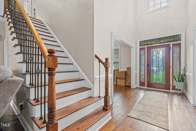 200 Heather Brook Cir, Spring Lake, NC 28390 - foyer entrance featuring baseboards, hardwood / wood-style flooring, a high ceiling, and stairway